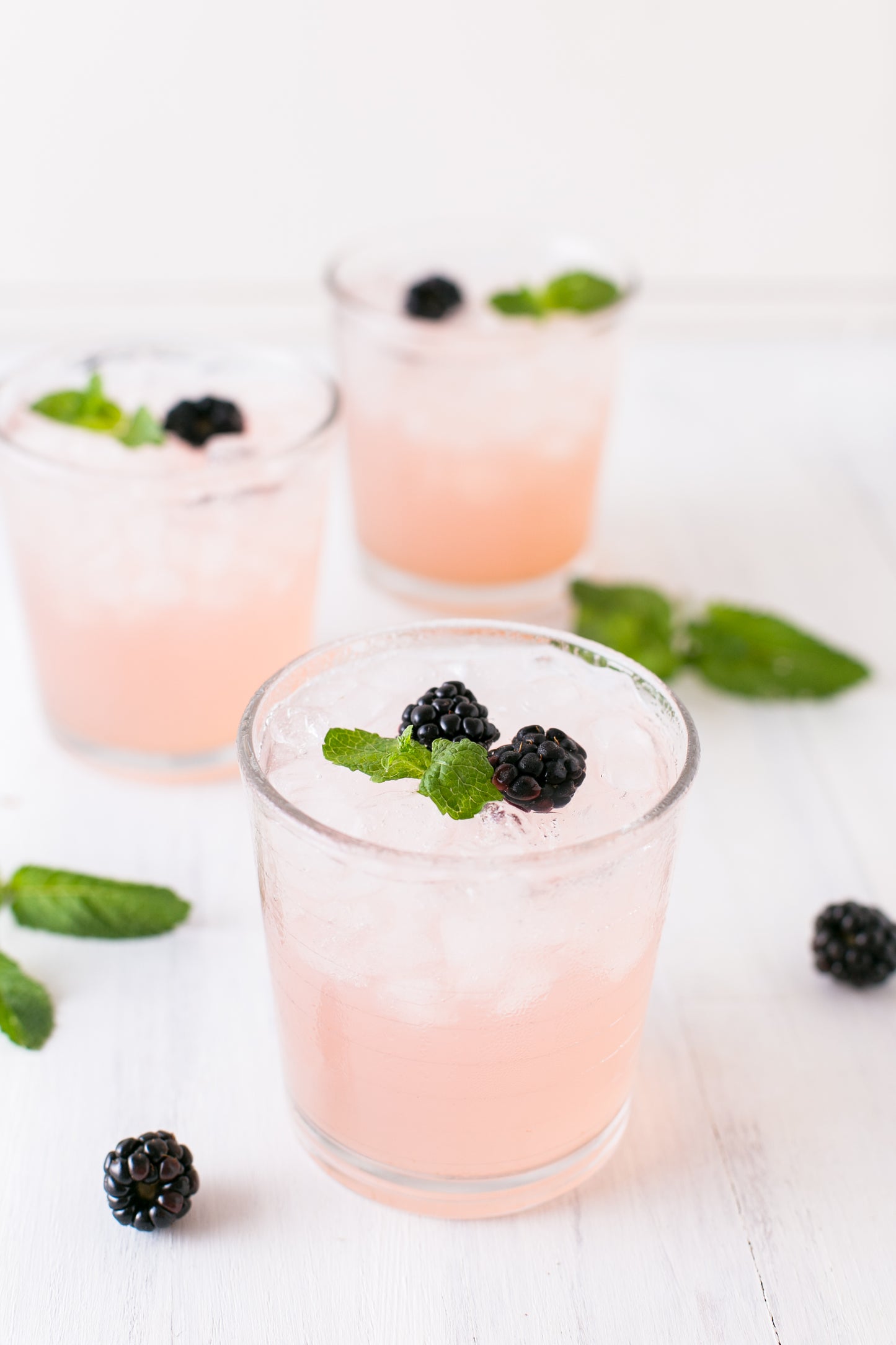 Blackberry Jalapeno Jam Cocktail Pink in Shot glass with blackberry garnish
