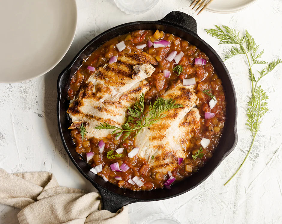 Mango salsa tilapia in cast iron skillet