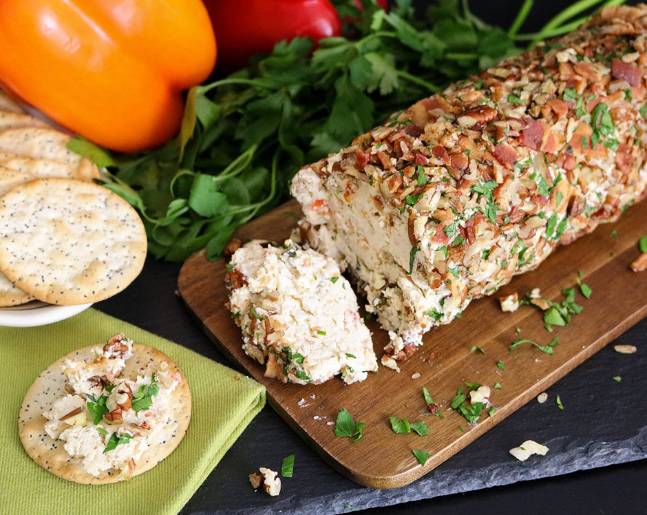 Bacon blue cheese log served with crackers and topped with walnuts and crumbled bacon