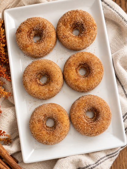 Baked Apple Cider Donuts with Mulling Spice with a Fall Feeling Background 