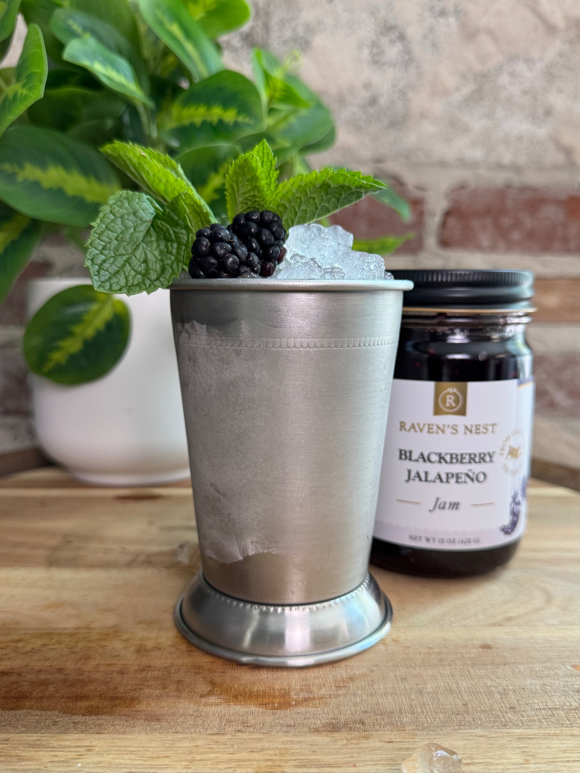 Give a Southern classic a spicy twist with this Blackberry Jalapeño Mint Julep featuring Raven’s Nest Blackberry Jalapeño Jam, fresh mint, blackberries, whiskey, and lemon.