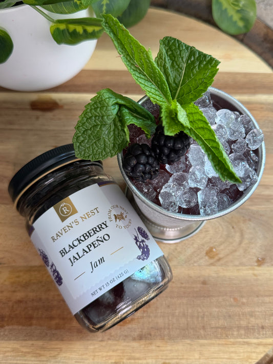 Give a Southern classic a spicy twist with this Blackberry Jalapeño Mint Julep featuring Raven’s Nest Blackberry Jalapeño Jam, fresh mint, blackberries, whiskey, and lemon.