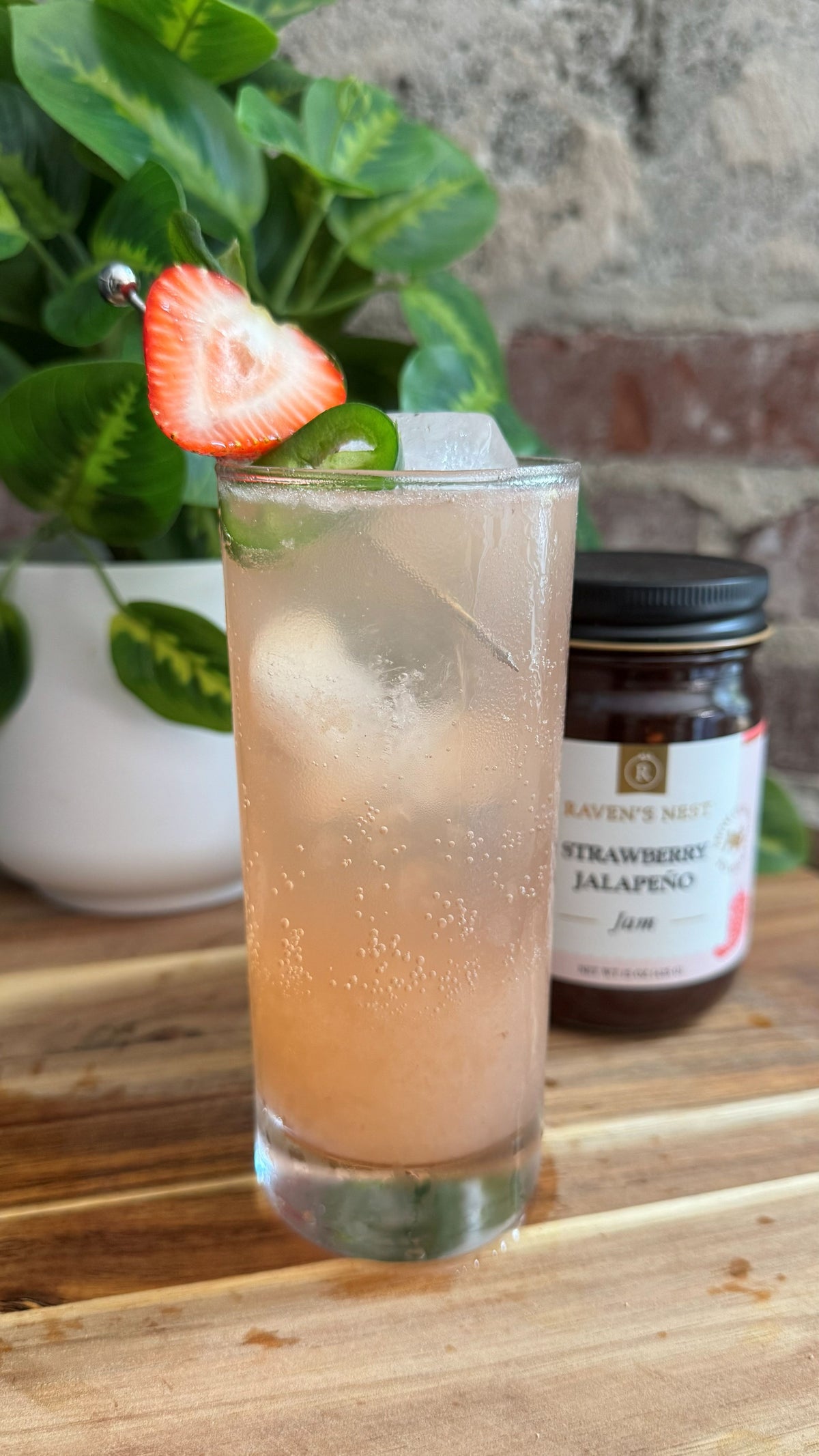 Make a refreshing Strawberry Jalapeño Paloma with Raven’s Nest Strawberry Jalapeño Jam Simple Syrup, tequila, fresh lime juice, and bubbly grapefruit soda.