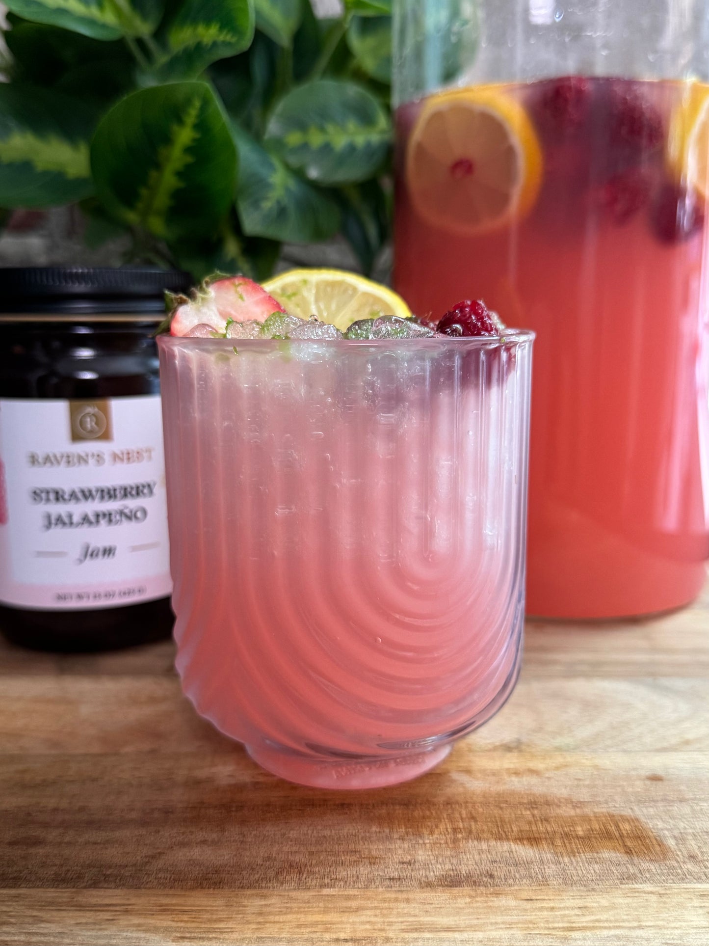 Make refreshing Strawberry Jalapeño Sangria with Raven’s Nest Strawberry Jalapeño Jam Simple Syrup, Sauvignon Blanc, fresh berries, lemon, and club soda.