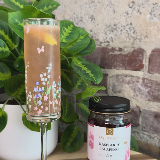 Celebrate with a Mother's Day 75 featuring Raven’s Original Raspberry Jalapeño Jam simple syrup, gin, fresh lemon juice, and sparkling Prosecco.