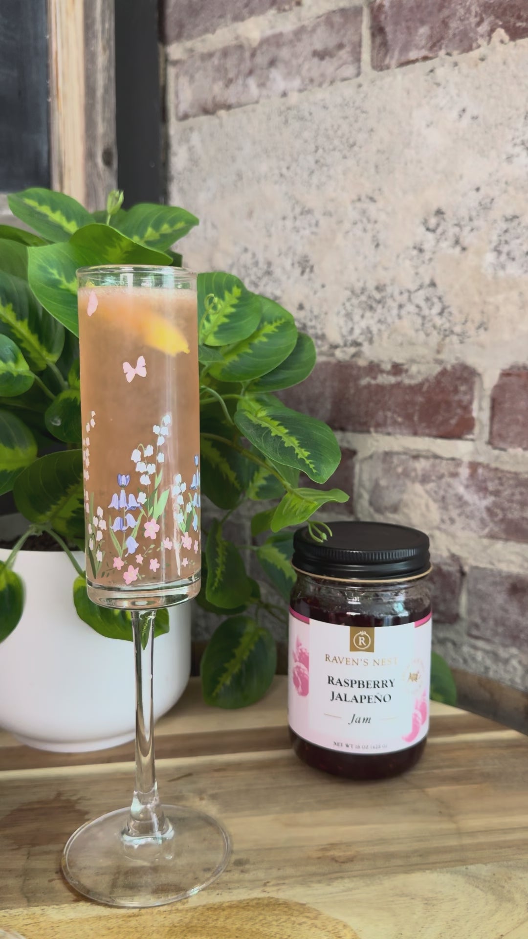 Celebrate with a Mother's Day 75 featuring Raven’s Original Raspberry Jalapeño Jam simple syrup, gin, fresh lemon juice, and sparkling Prosecco.