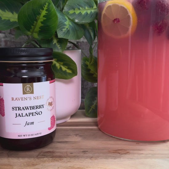 Make refreshing Strawberry Jalapeño Sangria with Raven’s Nest Strawberry Jalapeño Jam Simple Syrup, Sauvignon Blanc, fresh berries, lemon, and club soda.