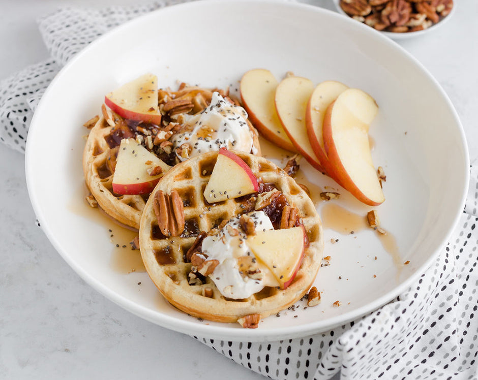 apple butter waffles topped with fresh apples, cream, pecans, and cider maple syrup made with Ravens Nest apple butter and mulling spice