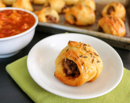 Chili grande sausage rolls made with Raven's Nest chili grande seasoning with a side of Raven's mango salsa