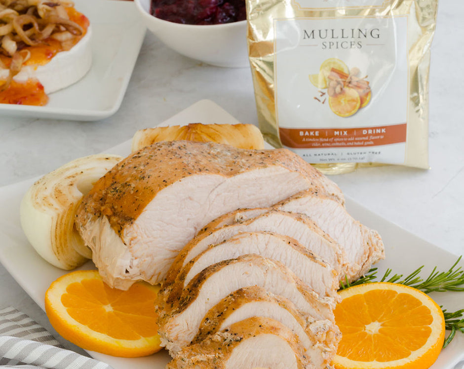 Raven's cider brined Thanksgiving turkey recipe made with Raven's Mulling Spices and garnished with oranges and rosemary