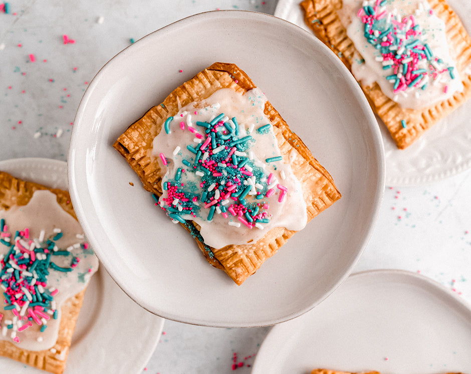 Homemade pop tarts filled with Raven's Nest cinnamon pear jam and topped with frosting and sprinkles